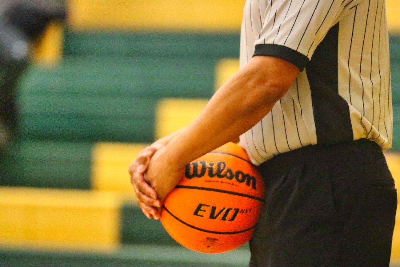 Nba referee holding basketball